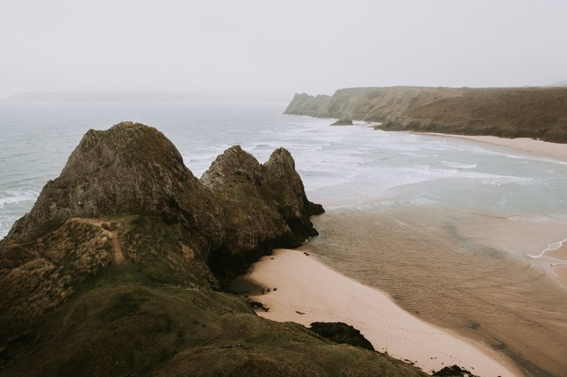 view of the ocean bay on a cloudy day at three cliff bay, three cliffs 4k