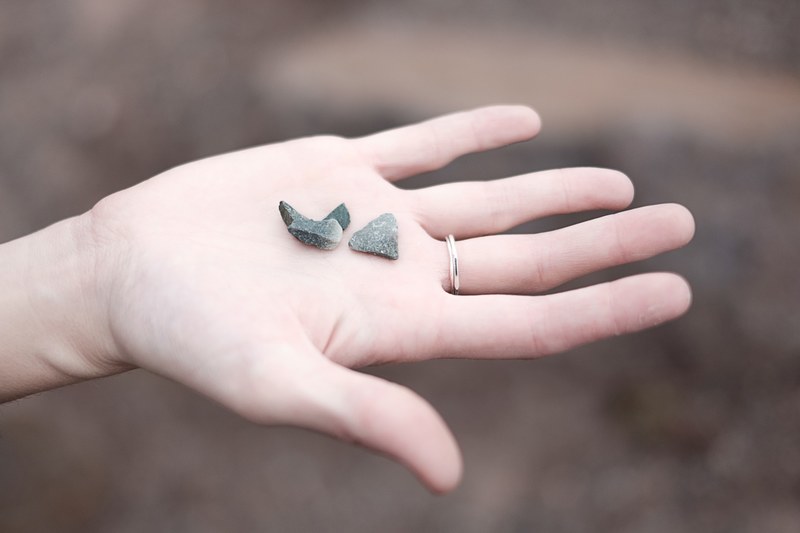 small stones in a persons outstretched hand, stones in hand 4k