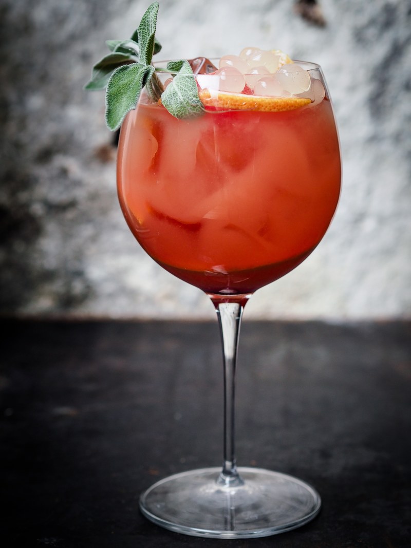 a macro view of a cocktail whiskey drink in a glass cup, cocktail 4k