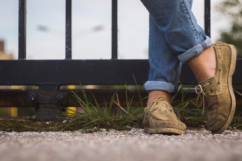 a man wearing rolled up jeans and boat shoes, boat shoes and jeans 4k