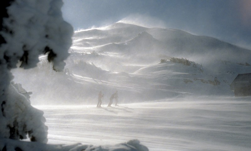 people hiking through windy snow at the bottom of mount bachelor in oregon, hiking mount bachelor oregon 4k
