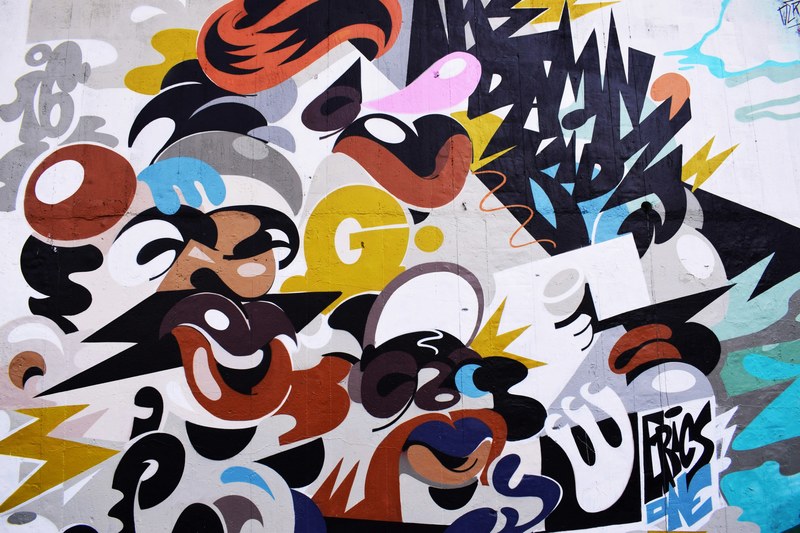 colorful creative abstract street mural on wall, random graffiti art 4k