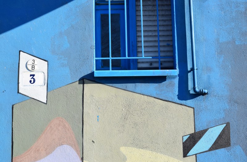 urban building and window spray painted blue with graffiti sign and number 3, light blue colour 4k