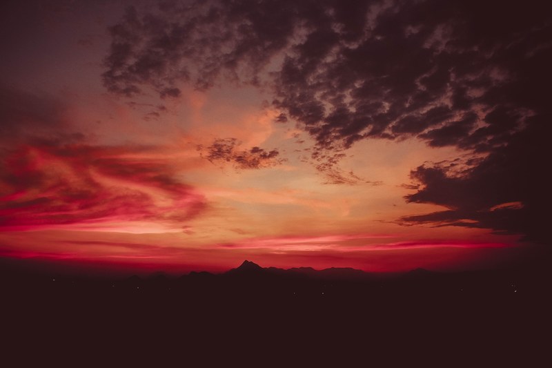 red and orange sunset with clouds obscuring part of the sky, sunset 4k
