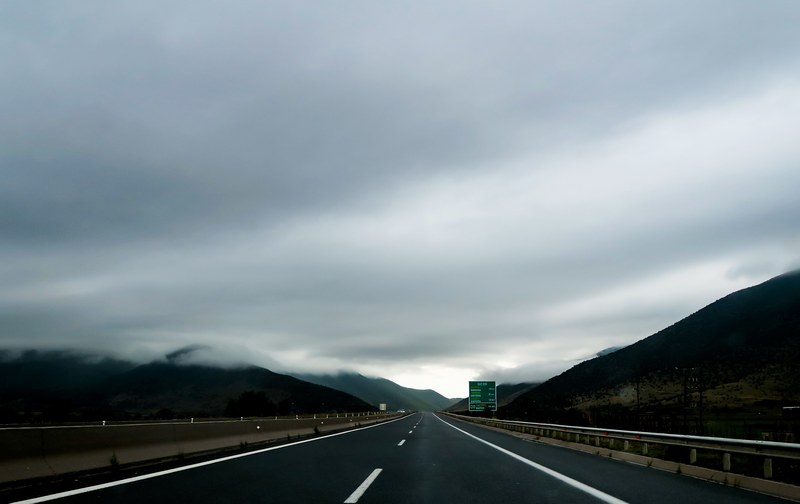 a cloudy overcast on top of a road in egnatia albania, albanian road on cloudy day 4k