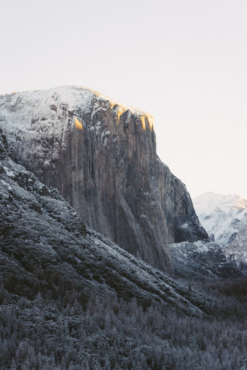 streaks of winter daylight break on el capitans snowy peaks in yosemite national park, sunrise at yosemite 4k