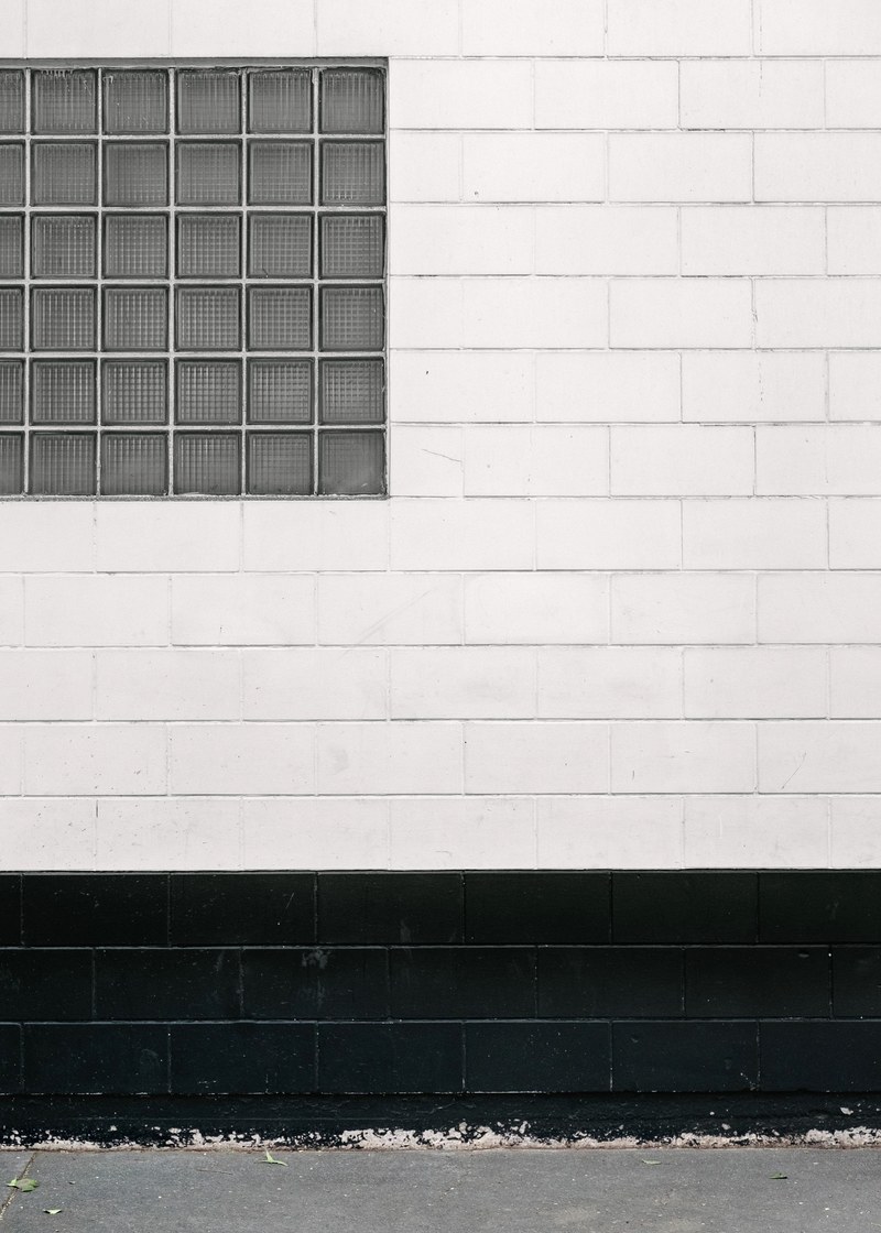 black and white shot of glass window on white wall in mexico city, window on white wall mexico 4k