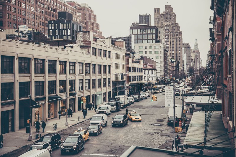 urban new york city street with brick buildings and traffic, a look out my window 4k