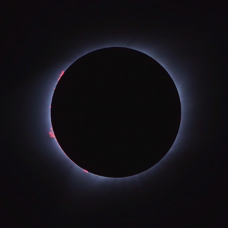 a lunar eclipse surrounded by darkness, _totality 4k