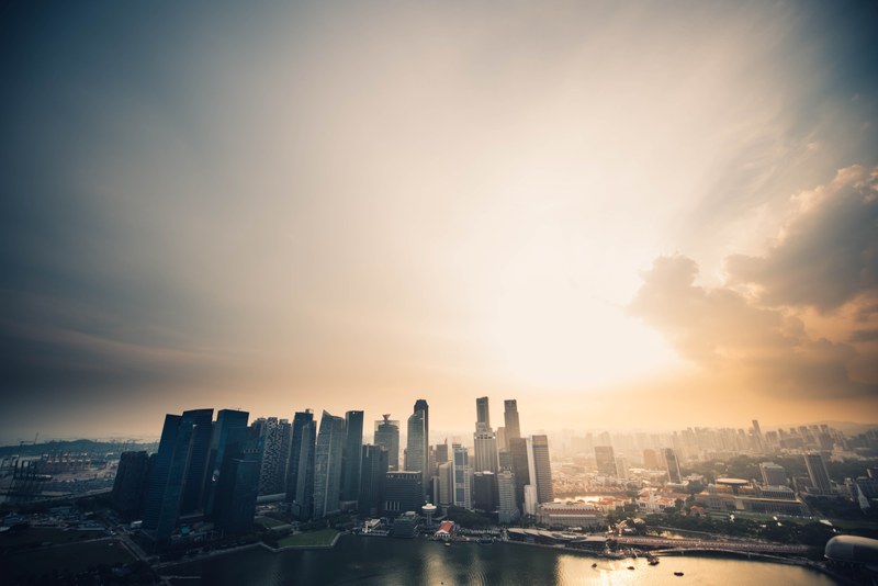 a beautiful skyline of a city on a river during golden hour, golden city skyline 4k