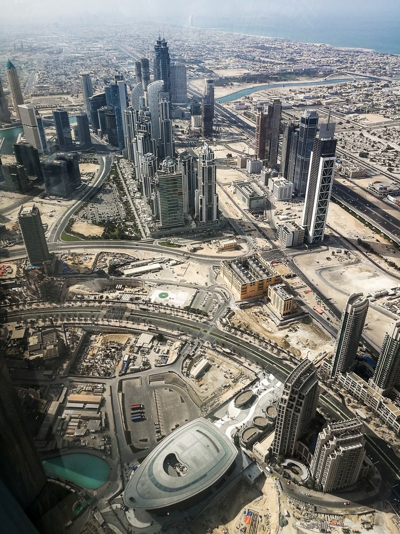 view from the burj khalifa on the skyline of dubai, high above high 4k