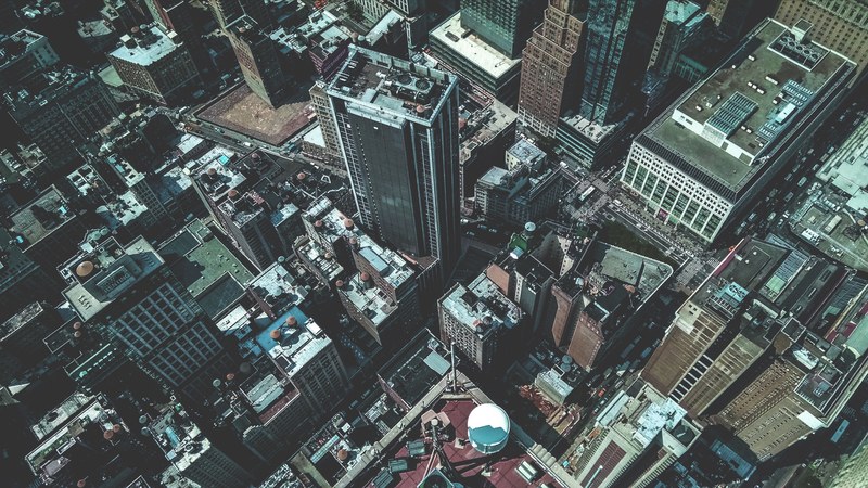drone view of the rooftops of skyscrapers and buildings in new york city, empire state building observatory 4k