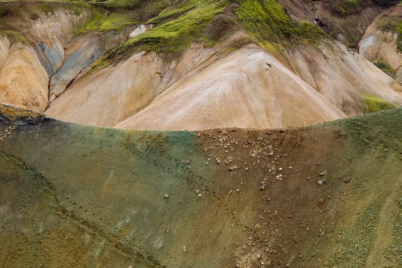 a vertical hillside partly obscuring the view on eroded moss covered hills, mossy icelandic hills 4k