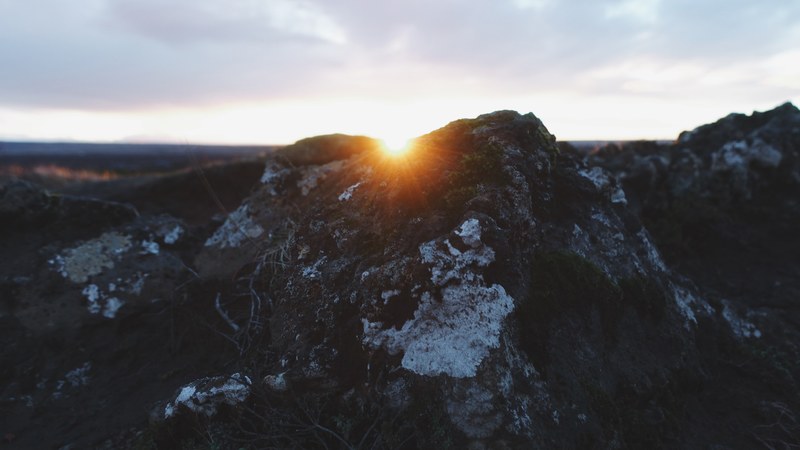 snow sits on mountains as the sun sets below the peak at keri, keri sunset_ 4k