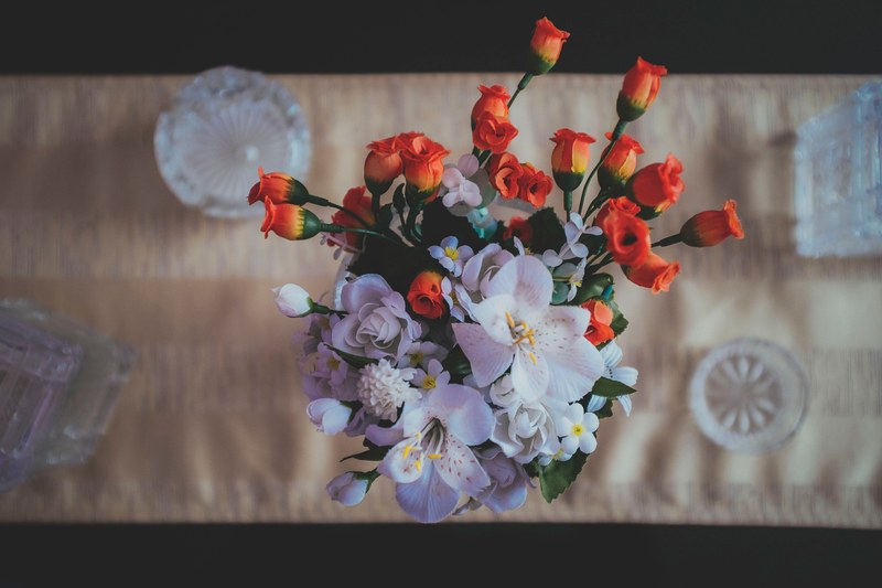 an overhead shot of an artificial bouquet with white and red flowers, white and red fake flowers 4k