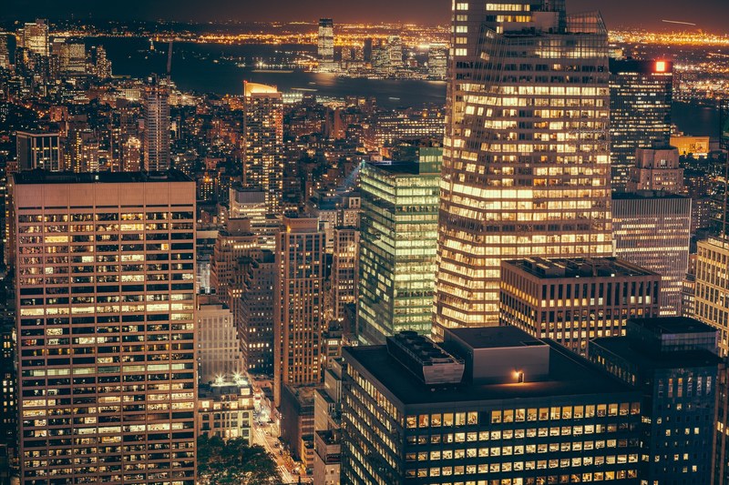 new york city skyscrapers light up the sky at night, twilight zone 4k