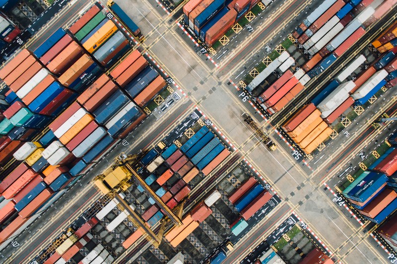 a drone shot of colorful shipping containers in a shipping terminal, shipping terminal in singapore 4k