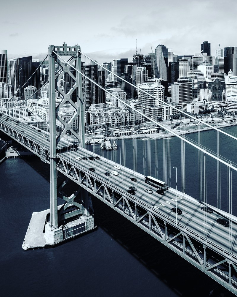 a black and white aerial shot of the bridge connecting san francisco to oakland, san francisco oakland bridge 4k