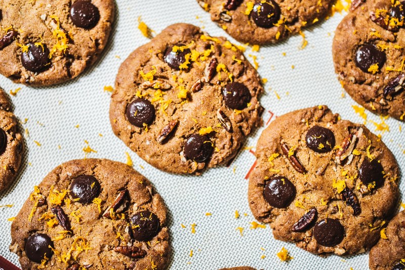 chocolate chip cookies fresh out of the oven on a baking sheet and parchment at crew collective amp caf, gourmet cookies 4k