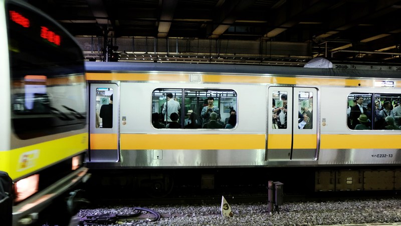 view from the railway platform on two trains on parallel tracks, parallel trains 4k