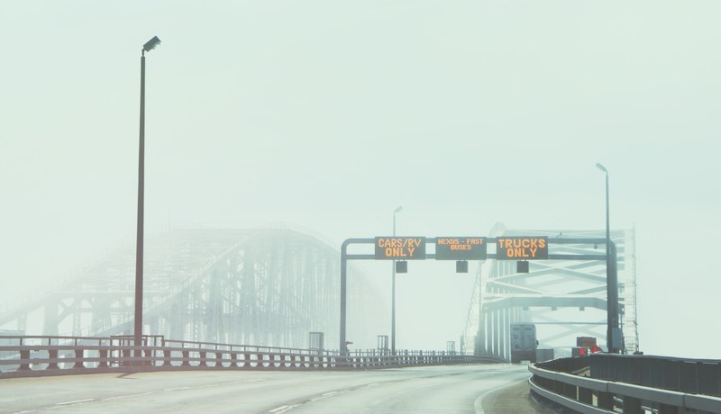 two bridges in the fog with a highway sign, highway bridges in mist 4k