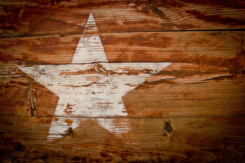 a wooden panel with a white star on it in south africa, south africa star 4k