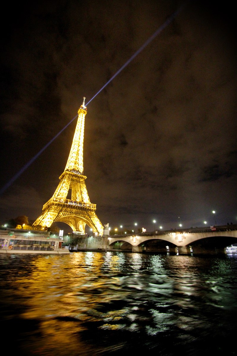 a night time shot of the brightly lit eiffel tower in paris, _eiffel tower night lights 4k