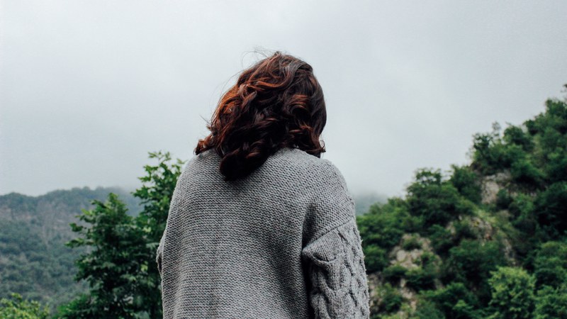 a woman in a gray knit sweater in green wilderness in ismailli, woman in gray sweater 4k