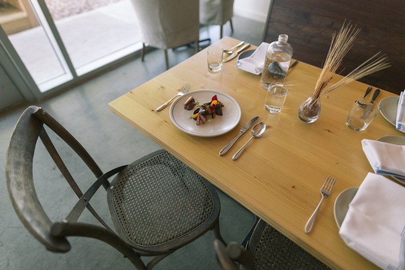 table set with a small appetizer plate at a trendy restaurant, trendy restaurant table 4k