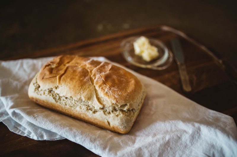 freshly baked loaf of bread with butter, fresh bread and butter 4k