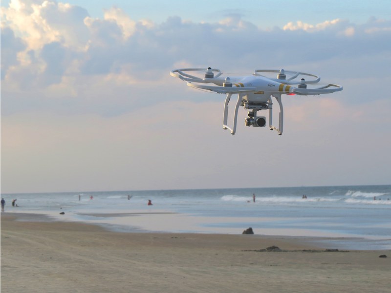 dji 3 drone flying above the sand beach at new smyrna beach, drone over a beach 4k