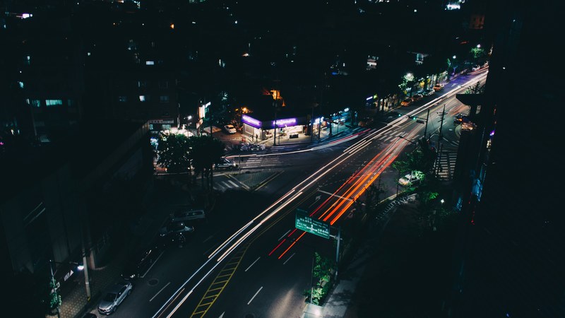 a long exposure shot of a dark street in seoul with orange light trails, dark seoul neighborhood 4k