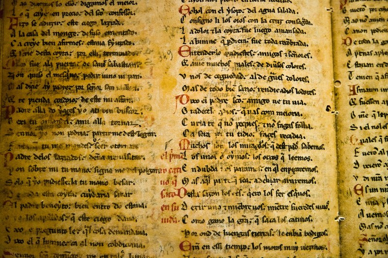 an ancient writing using old calligraphy on an old book in san milln de la cogolla, ancient writing on old book_ 4k