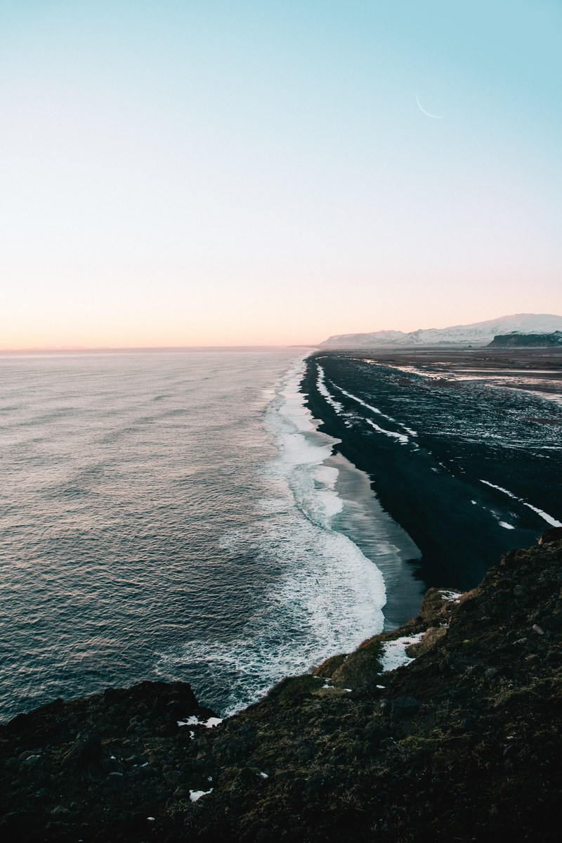 view of the black sand beach coastline in iceland, black sands beach 4k