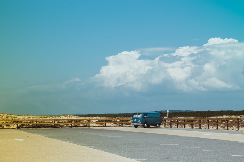 blue old vintage volkswagen transporter parked on an empty parking lot in plage du cap de lhomy, vintage volkswagen beetle on empty parking lot 4k