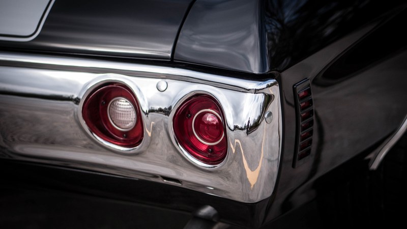 reflective chrome fender of classic car with red tail lights, chrome fender and lights 4k