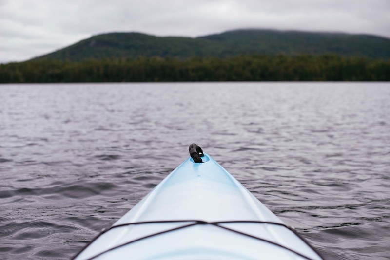 view from a kayak on its bow and a choppy lake, in a kayak on a lake 4k