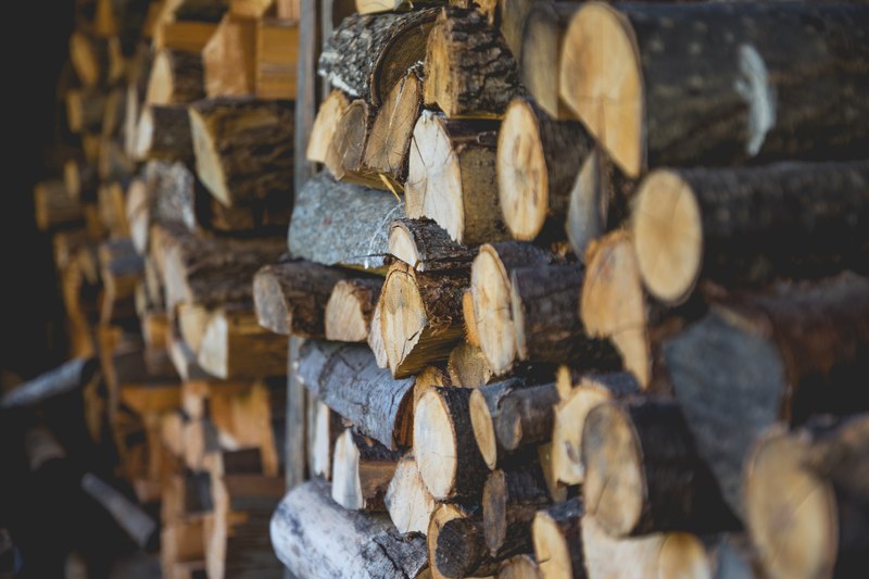 stacks of firewood near a wall, firewood stacks 4k