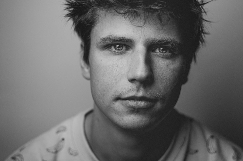 black and white close up fashion shoot shot of attractive man with tousled hair in zagreb, meitz 4k