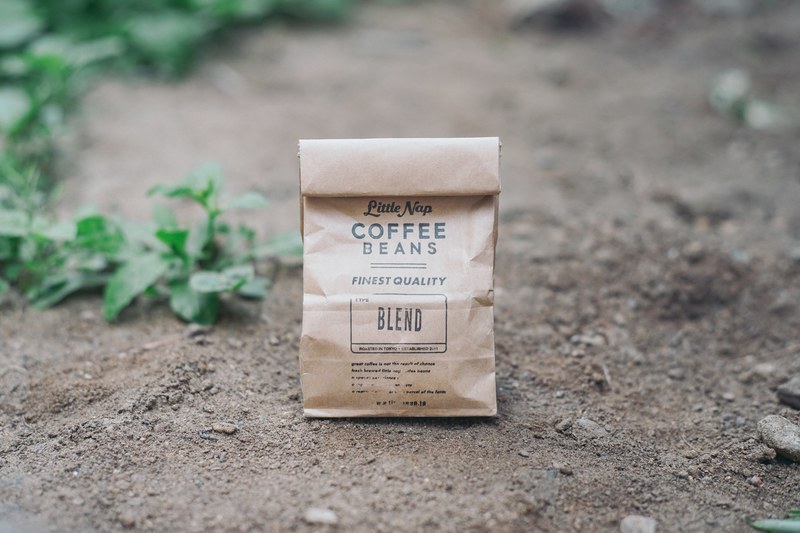 brown bag of coffee beans outside, bag of beans 4k