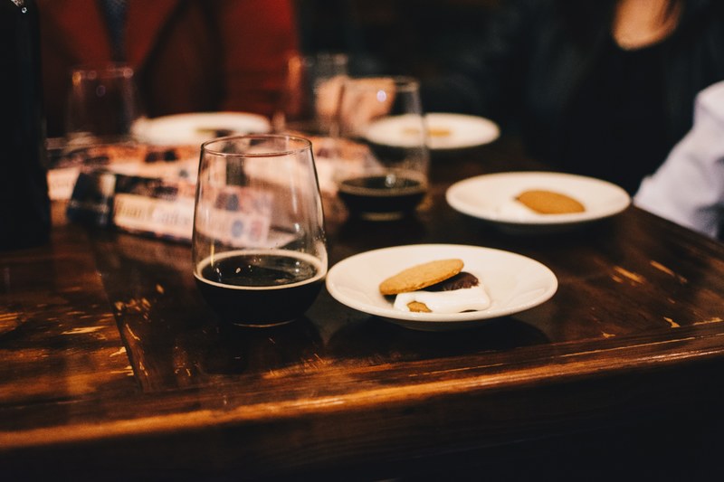 a table of glass cups with wine and plate with snacks in santiago de quertaro, table of wine and snacks 4k