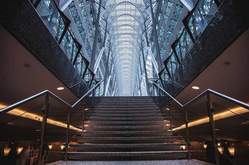 an impressive hallway with a staircase in a building with a high ceiling, impressive hallway 4k