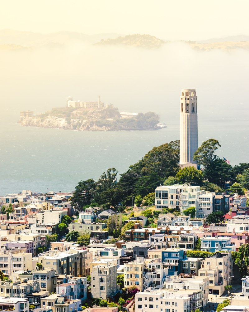 aerial view of city buildings in san francisco bay area, coit tower from above 4k