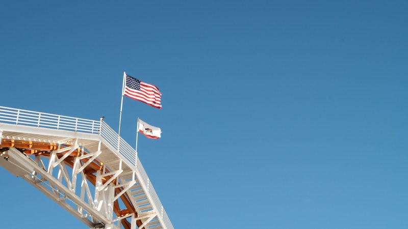 flag blue sky american flag and pier 4k