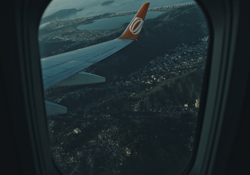 view from a plane window on the suburbs of rio de janeiro below, flight over rio de janeiro 4k