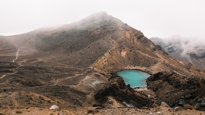 desolate blue lake between mountains in tongariro alpine crossing, downtown mordor 4k
