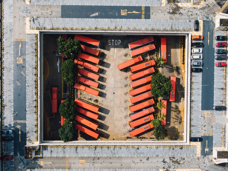 drone shot of parked buses and cars at depot in bishan int bishan singapore, buses is depot at bishan singapore 4k