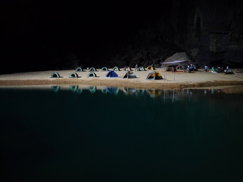 camp of tents by the lake at night in vietnam, desert camping 4k