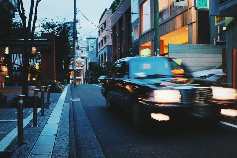the evening falls on a dimly lit street in tokyos shibuya district, zen capital 4k