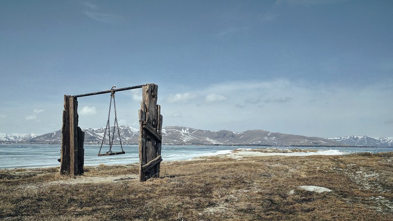 a swing on a field by a lake, swing on field 4k